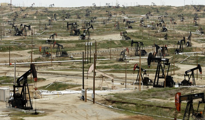FILE PHOTO / BEST BLOOMBERG PHOTOS FOR 2011: Oil pumps stand at the Chevron Corp. Kern River oil field in Bakersfield, California, U.S., on Tuesday, March 29, 2011. While most of the oil has been removed from the field, enhanced production technologies such as steam flooding have made it possible to extract much of the oil once considered unfeasible to recover. Photographer: Ken James/Bloomberg