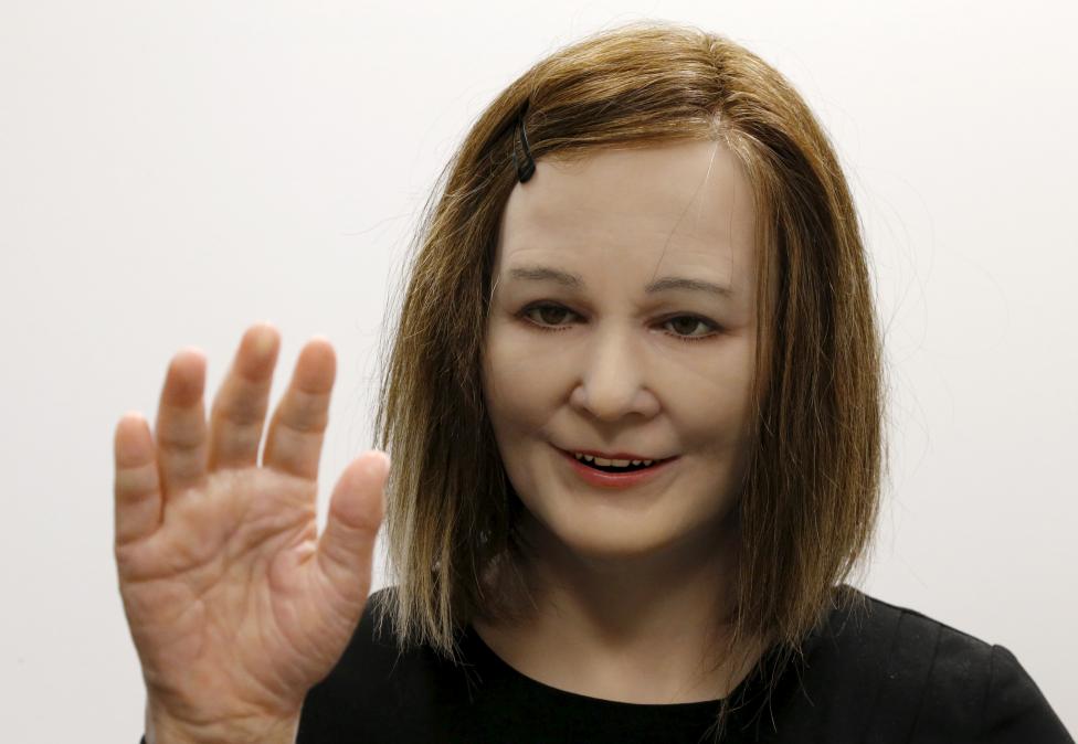 Nadine, a humanoid created by Nanyang Technological University's Professor Nadia Thalmann and her team, reacts to the presence of people during an interview with Reuters at their campus in Singapore March 1, 2016. With her brown hair, soft skin and expressive face, Nadine is a new brand of human-like robot that could one day, scientists hope, be used as a personal assistant or care provider for the elderly. REUTERS/Edgar Su