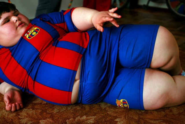Dzhambulat Khotokhov, 6, one of the fattest boys in the world, at home in Terek, in southern Russia. Now 1.4 metres tall and weighing about 100 kg, Khotokhov has grabbed world attention as the biggest kid in the world since he was three. .Khotokhov lives with his mother Neyla and his brother, 14-year-old Mukha. .