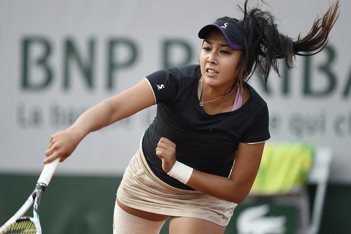 Kazakhstan's Zarina Diyas returns the ball to Czech Republic's Petra Kvitova during their French tennis Open first round match at the Roland Garros stadium in Paris on May 26, 2014. AFP PHOTO / PASCAL GUYOT